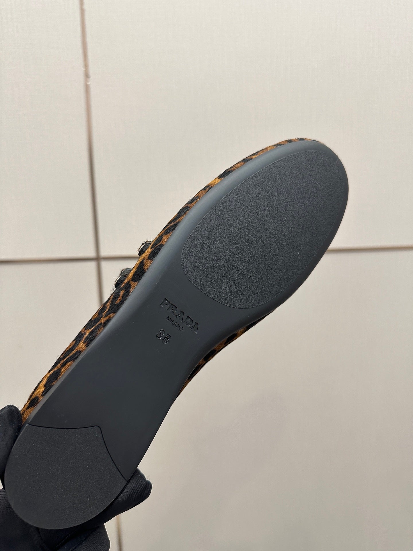 Prada leopard-print flat loafer outsole, dark rubber sole with Prada branding