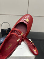 Prada women’s red leather loafer upper with gold logo plaque and buckled strap