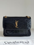 YSL flap bag in dark quilted leather with gold YSL logo and chain strap