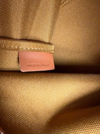 MiuMiu bag, tan leather brand patch tag on textured fabric panel