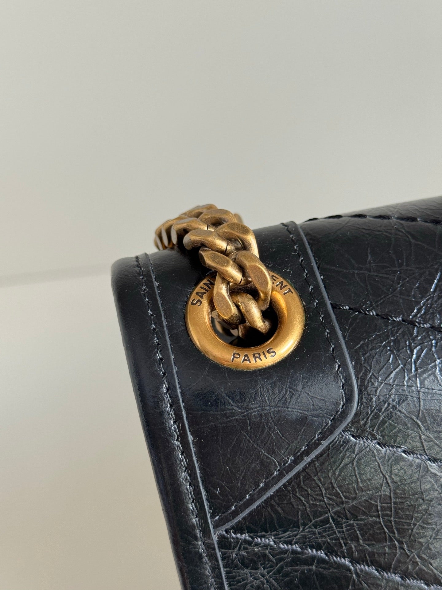 YSL flap bag with gold chain and round Saint Laurent Paris clasp