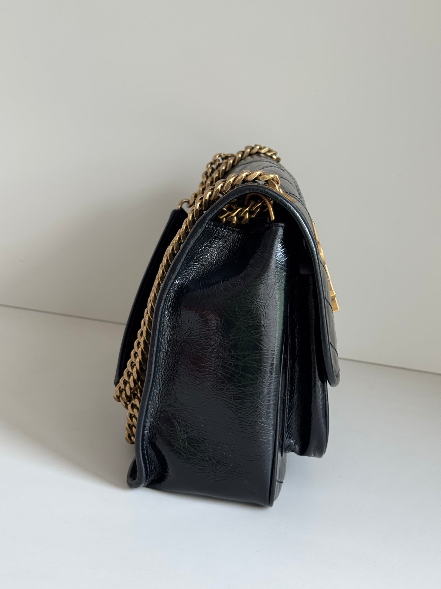YSL shoulder bag with gold chain strap and flap top, dark leather