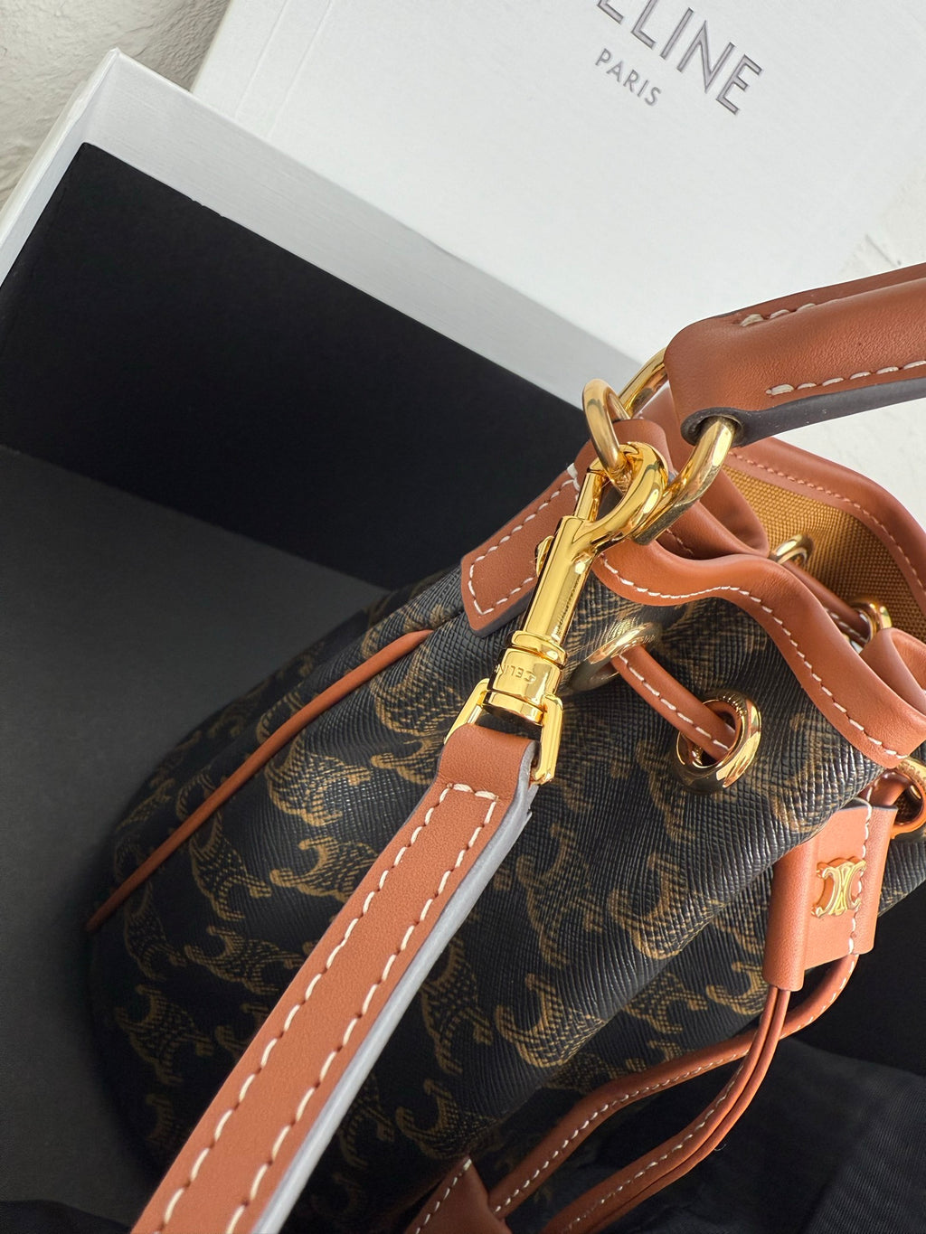 MiuMiu bag, monogram canvas bucket bag with tan strap, gold clasp and stitched seams