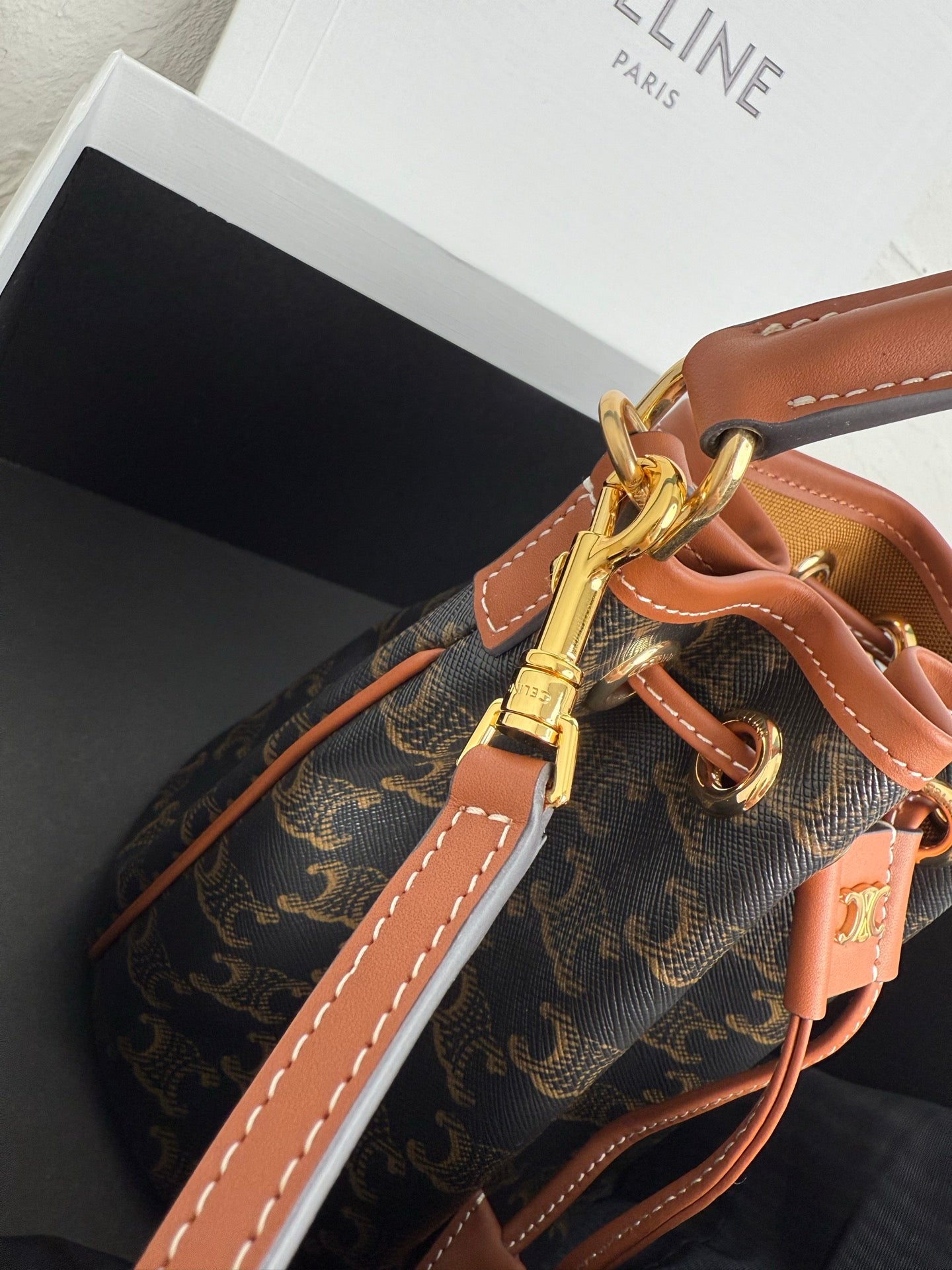 MiuMiu bag, monogram canvas bucket bag with tan strap, gold clasp and stitched seams