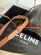 MiuMiu bag, monogram bucket bag with tan adjustable shoulder strap and gold buckles