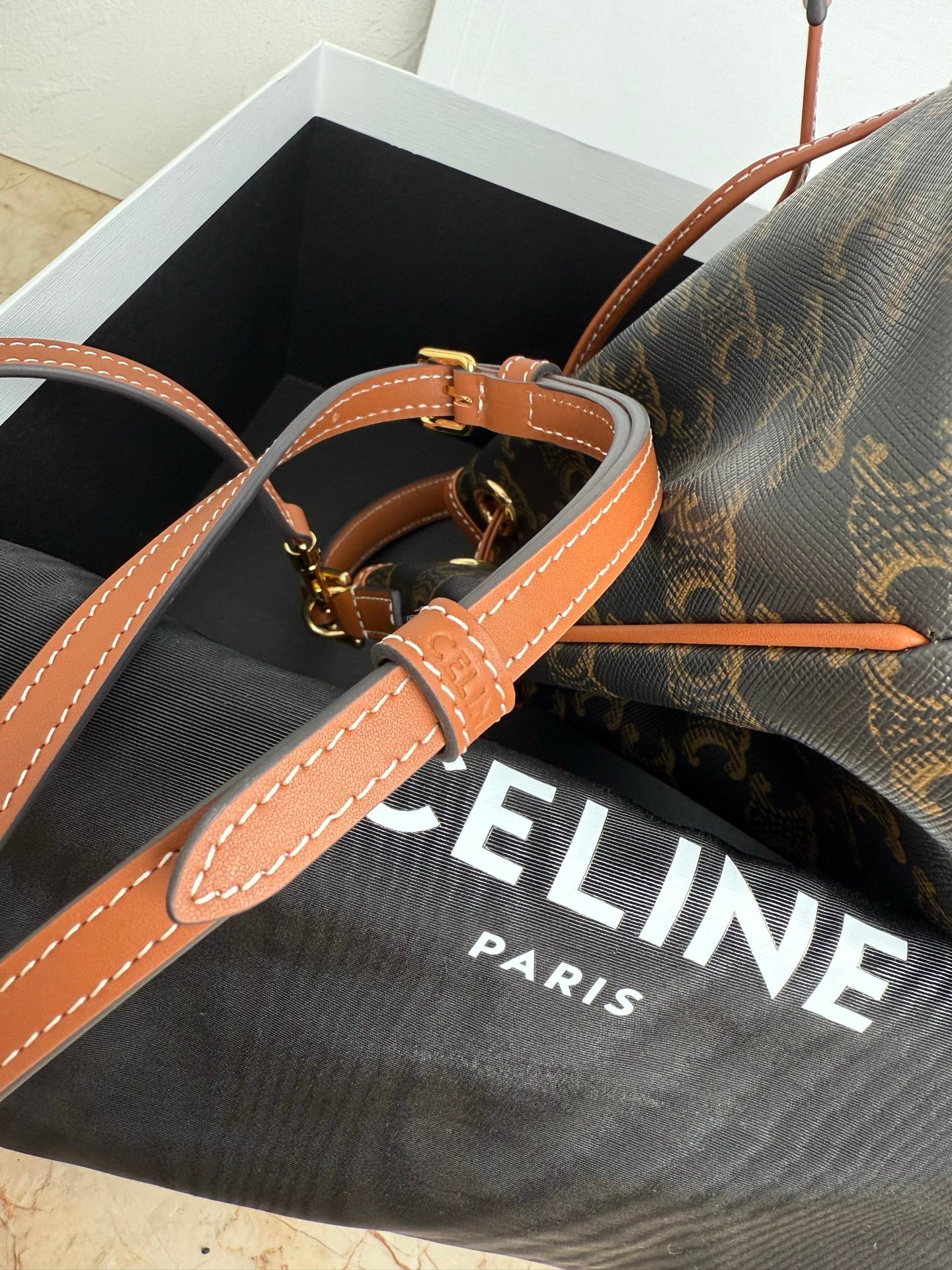MiuMiu bag, monogram bucket bag with tan adjustable shoulder strap and gold buckles