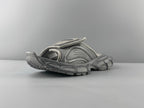 Light gray slide sandals with perforated upper and ribbed chunky sole