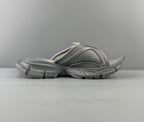 Light gray slide sandals with perforated top and cushioned straps