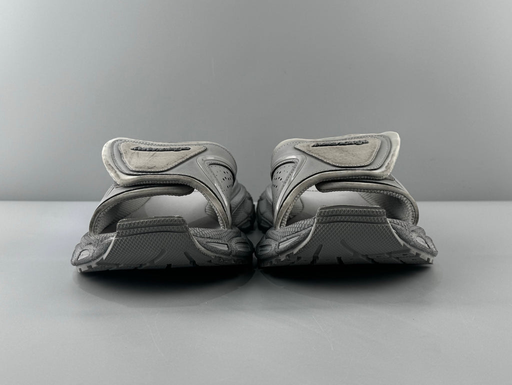 Pair of light gray sandals with adjustable straps and cushioned footbed