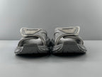 Pair of light gray sandals with adjustable straps and cushioned footbed