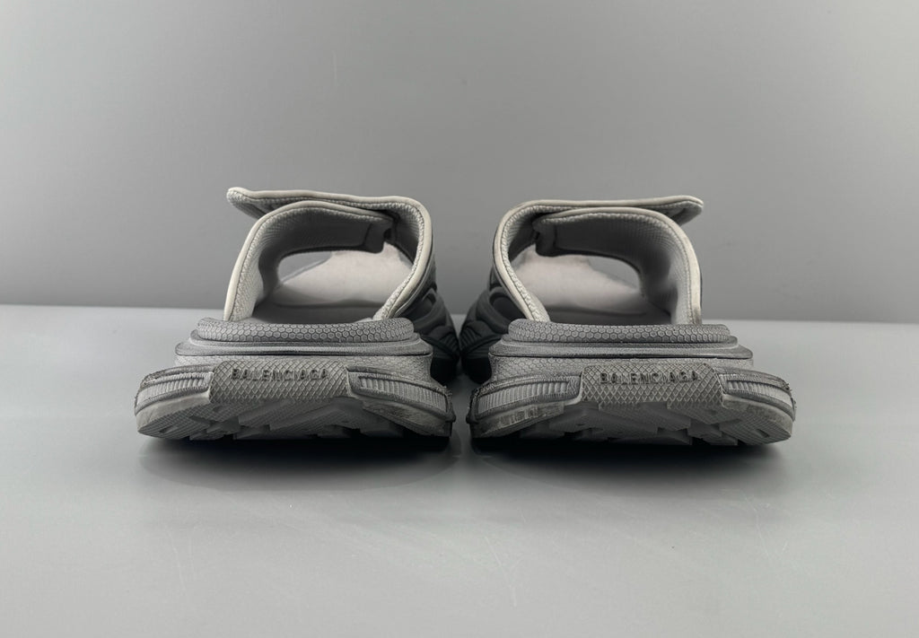 Pair of light gray sandals rear view with padded heel straps