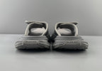 Pair of light gray sandals rear view with padded heel straps