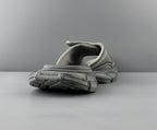 Light gray sandals heel view with textured tread outsole