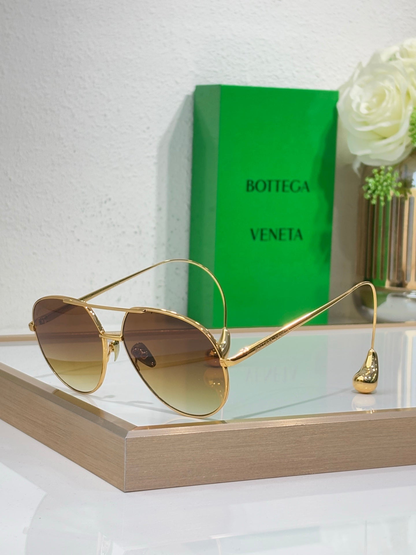 Gold-tone sunglasses with gradient lenses and slim metal arms