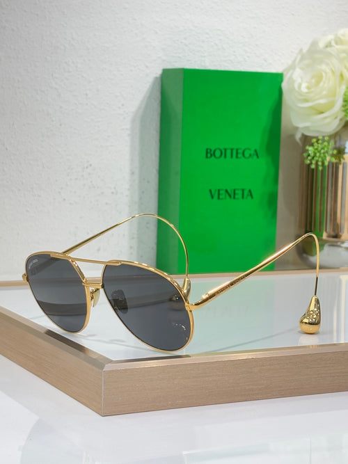 Gold-tone sunglasses with dark lenses and slim metal arms