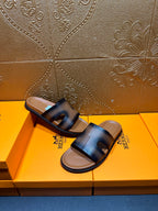 Hermes dark blue leather slide sandals with open toe and thick cushioned base