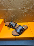 Hermes dark blue leather slide sandals with wide buckle-style front strap