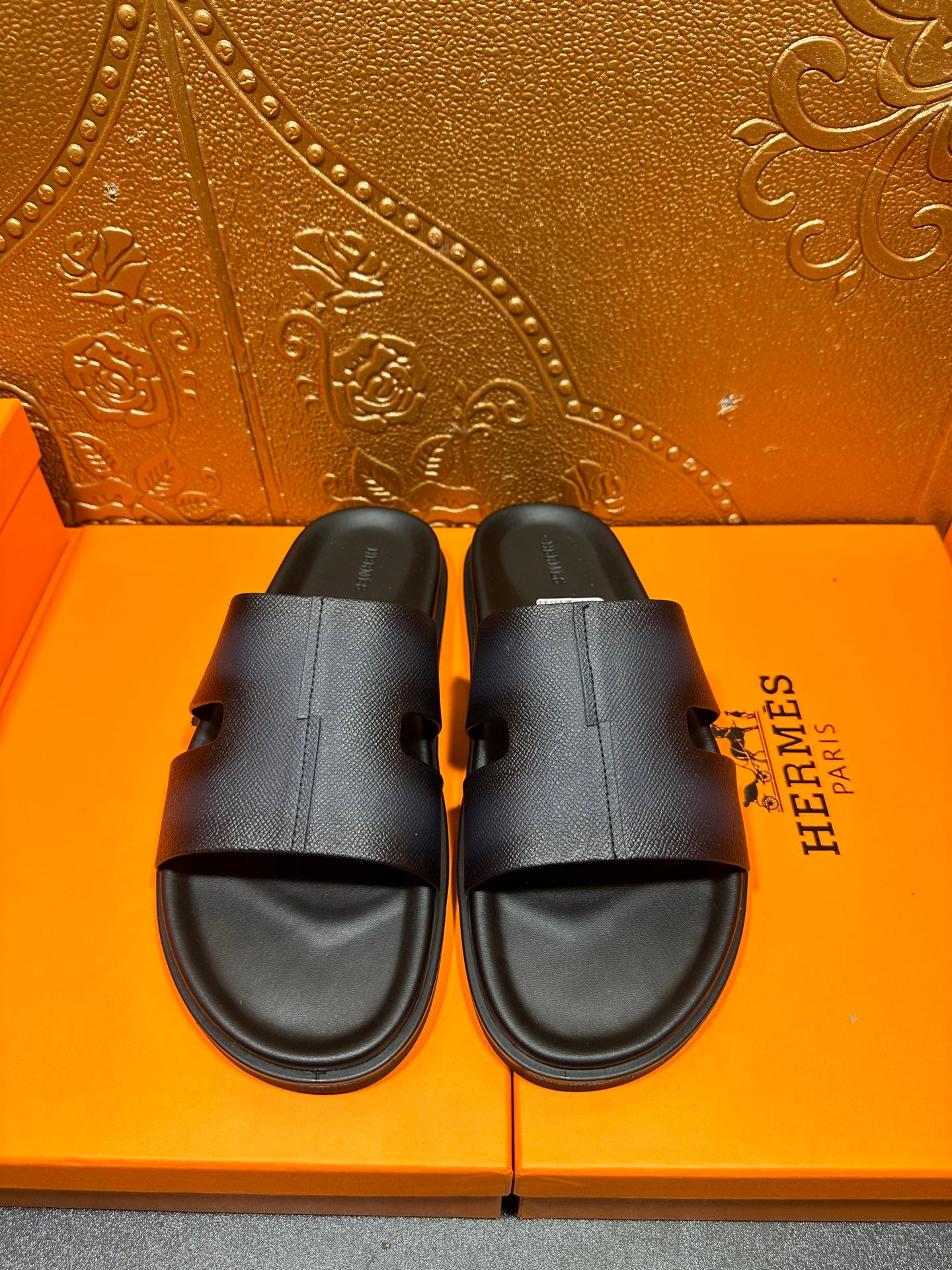 Hermes dark leather slide sandals with single wide strap and open toe