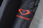 Dark pants leg with red heart and BALENCIAGA logo embroidery