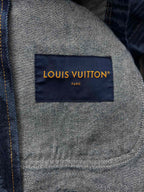 Blue jacket interior label reading LOUIS VUITTON PARIS