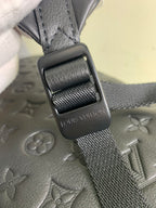 Louis Vuitton bag adjustable strap with metal buckle and embossed monogram leather