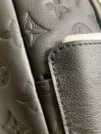Louis Vuitton bag leather pocket detail with contrast stitching and zipper edge