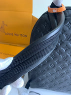 Louis Vuitton bag top handle strap and side panel with embossed monogram texture