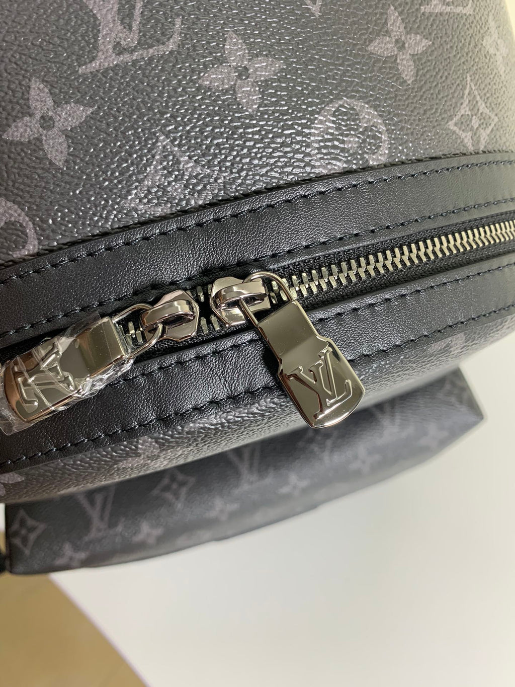 Louis Vuitton bag zipper pull with gold-tone hardware
