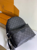 Monogram backpack with front diagonal zipper and adjustable shoulder strap