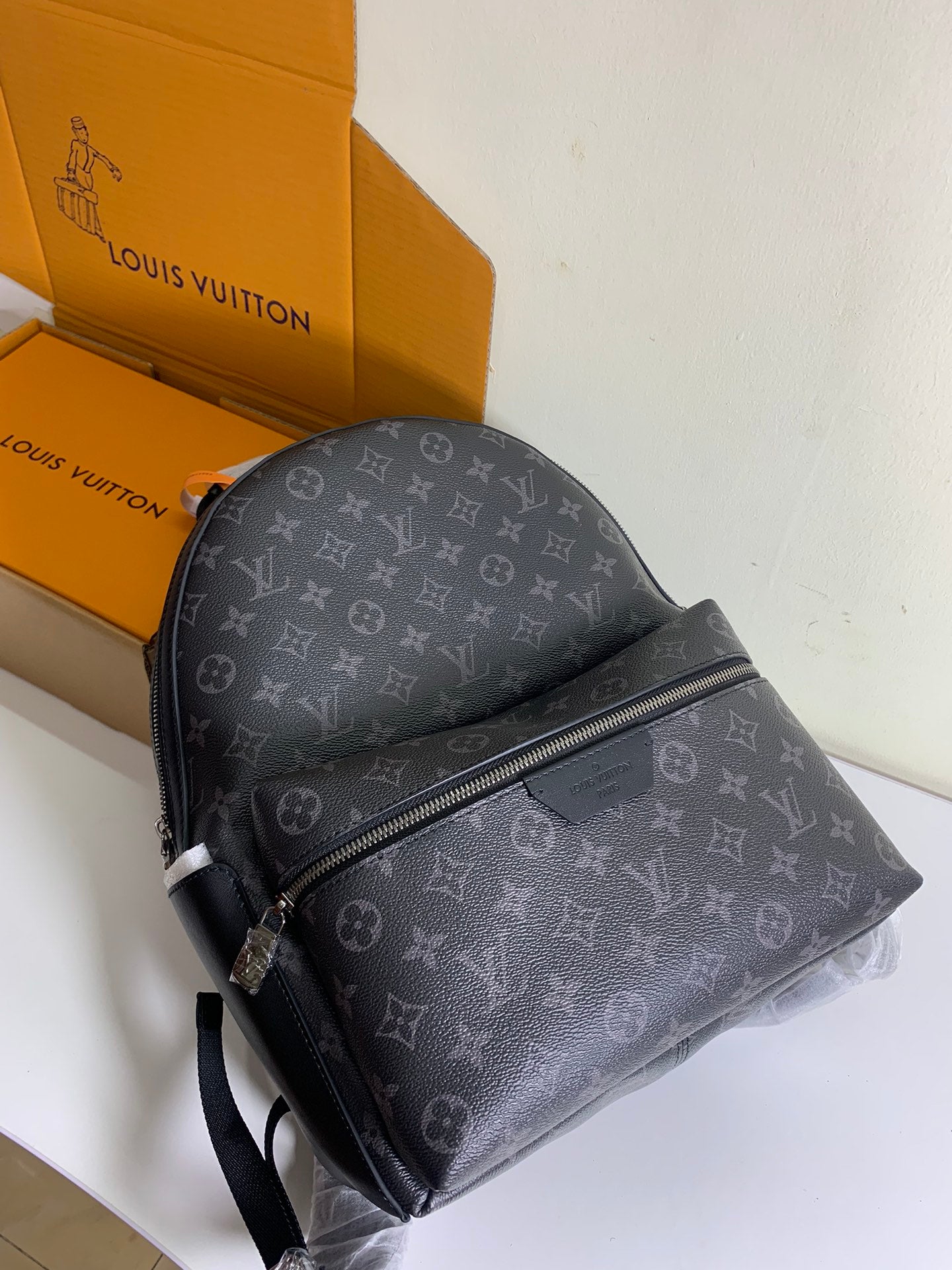 Monogram backpack with front diagonal zipper and adjustable shoulder strap