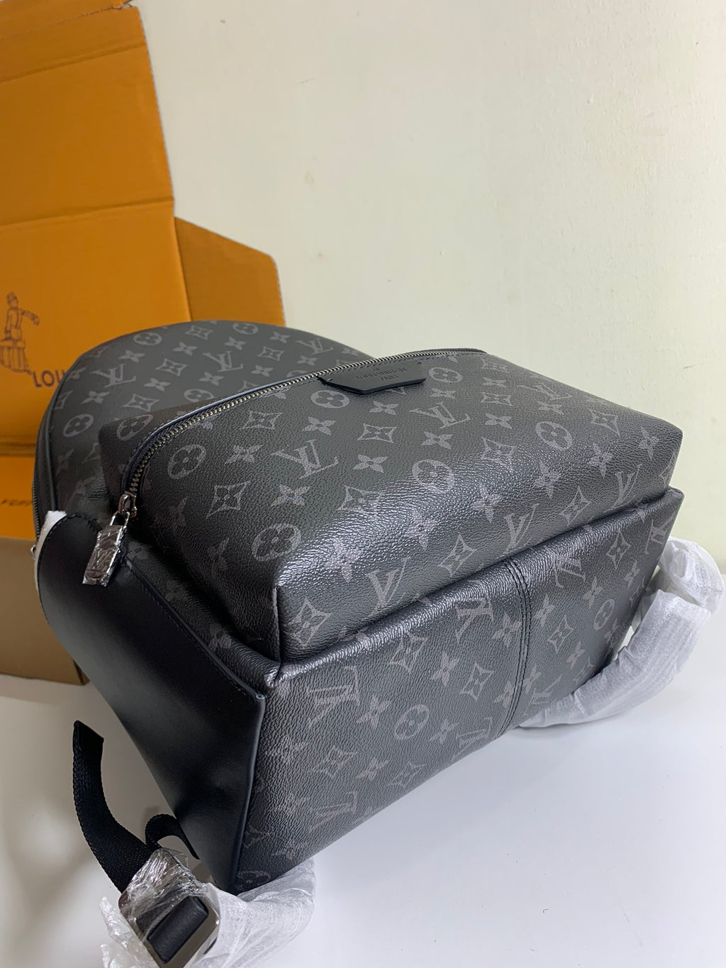 Monogram shoulder backpack with curved top and front crossbody strap