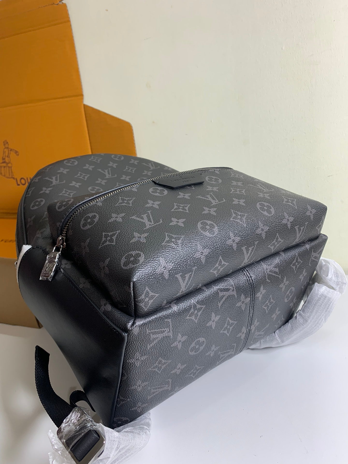 Monogram shoulder backpack with curved top and front crossbody strap