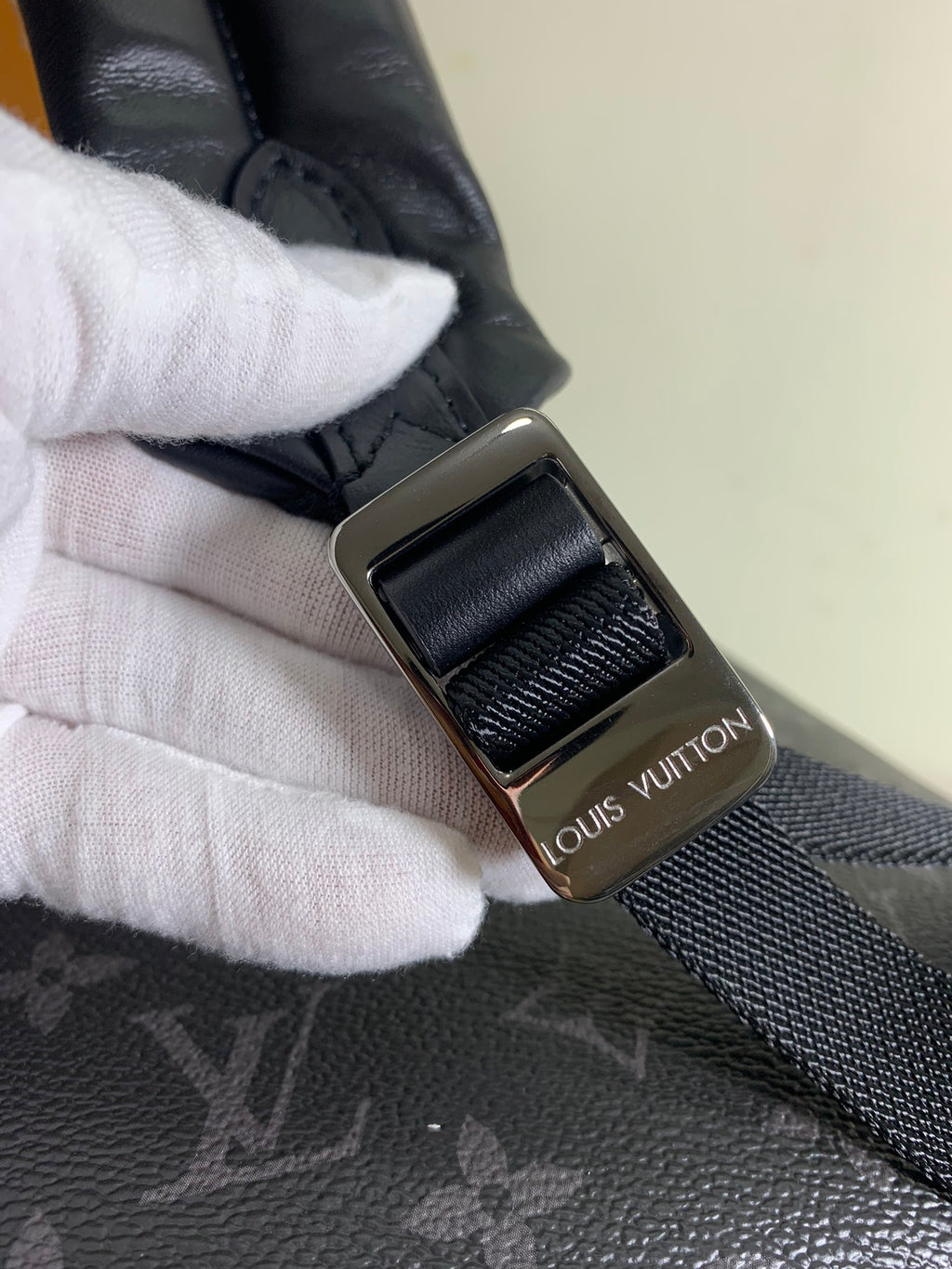 Louis Vuitton bag strap with metal buckle and monogram accent