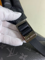 Louis Vuitton bag strap with metal buckle and monogram accent