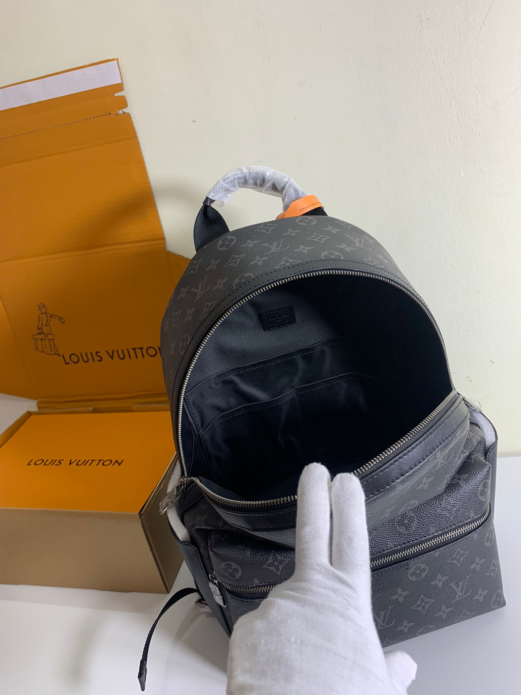 Louis Vuitton monogram backpack with front zipper and top handle