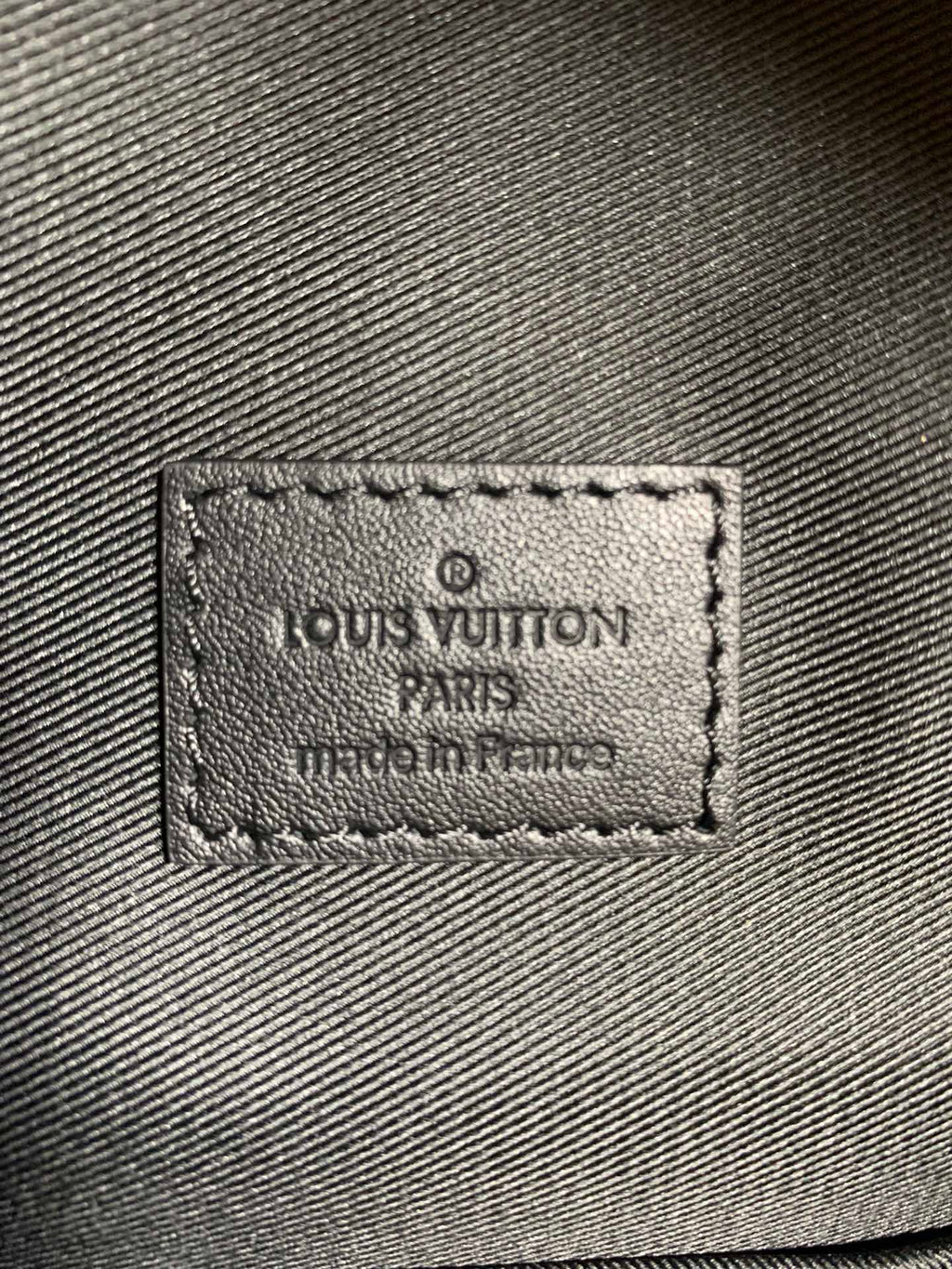 Louis Vuitton bag fabric label patch with stamped text