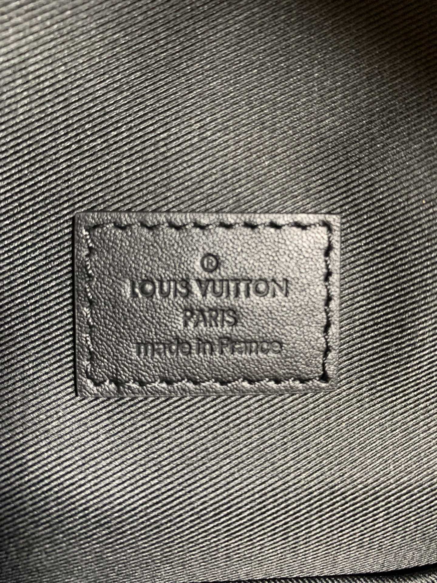 Louis Vuitton bag fabric label patch with stamped text