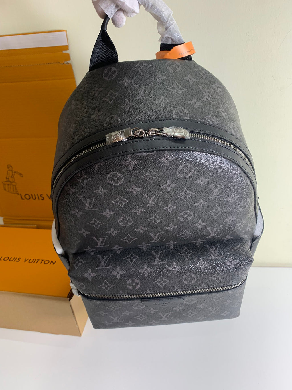 Monogram backpack with top handle and front horizontal zipper