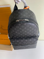 Monogram backpack with top handle and front horizontal zipper