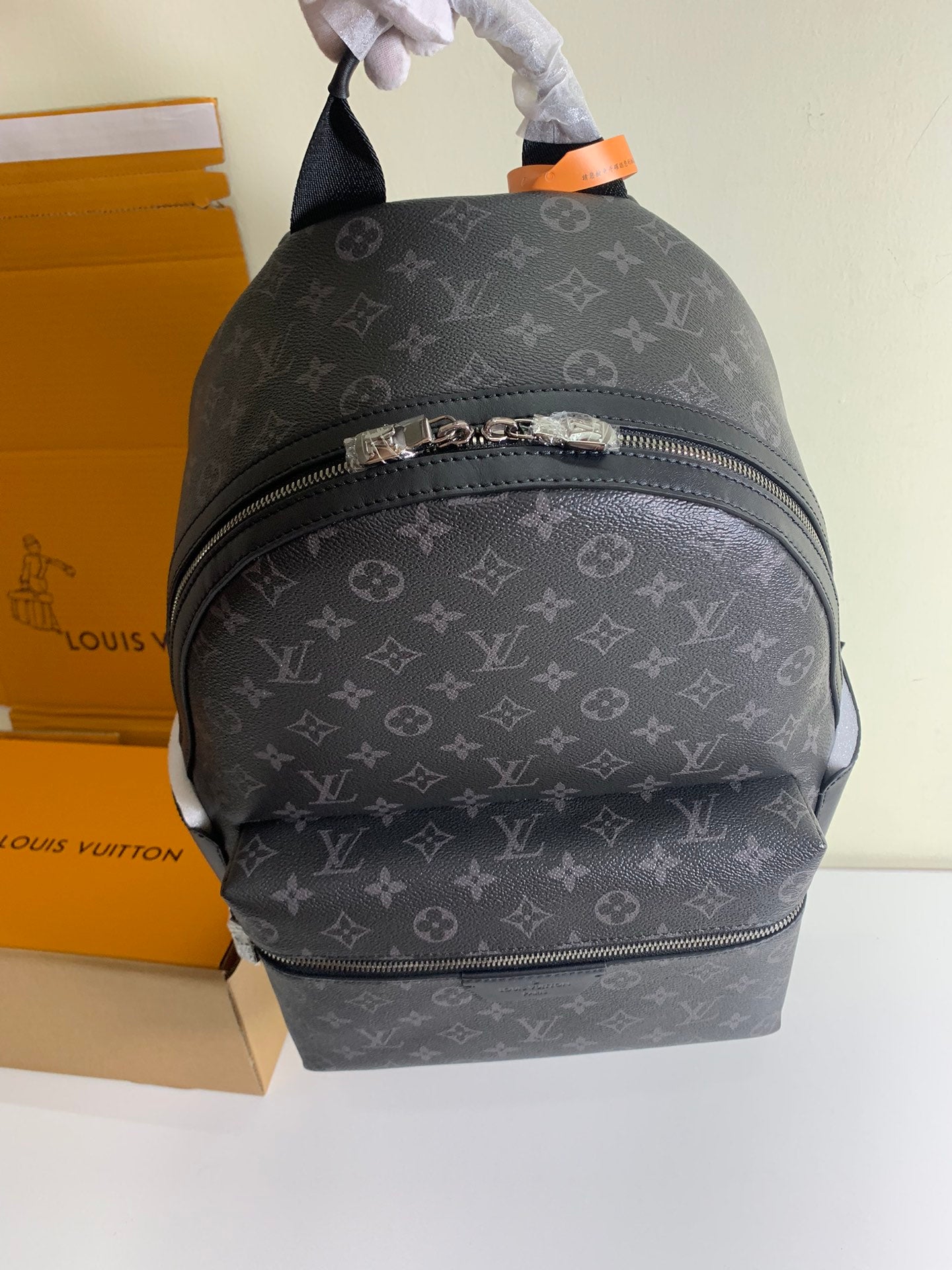 Monogram backpack with top handle and front horizontal zipper