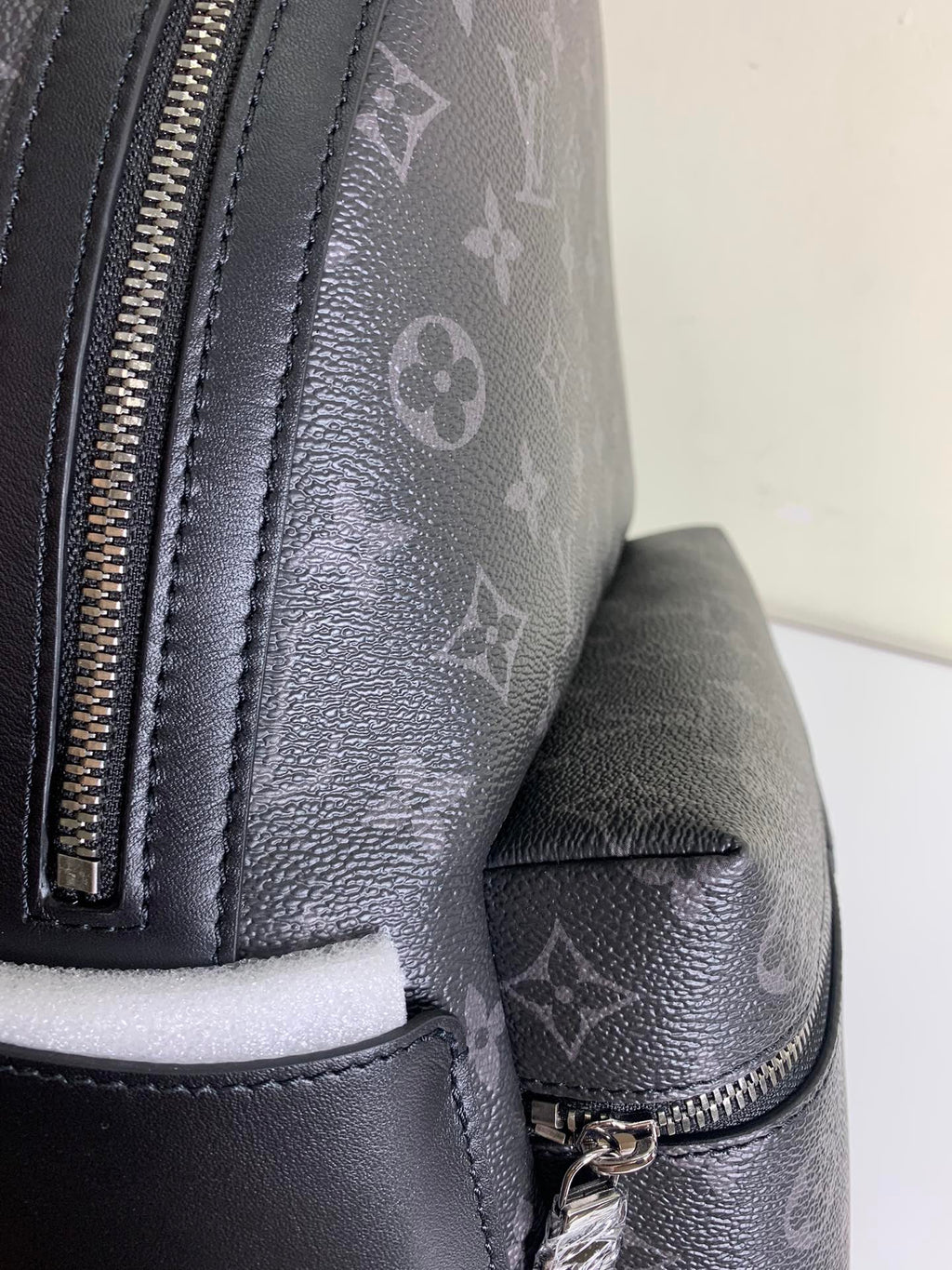 Louis Vuitton bag side pocket with zipper and textured leather panel