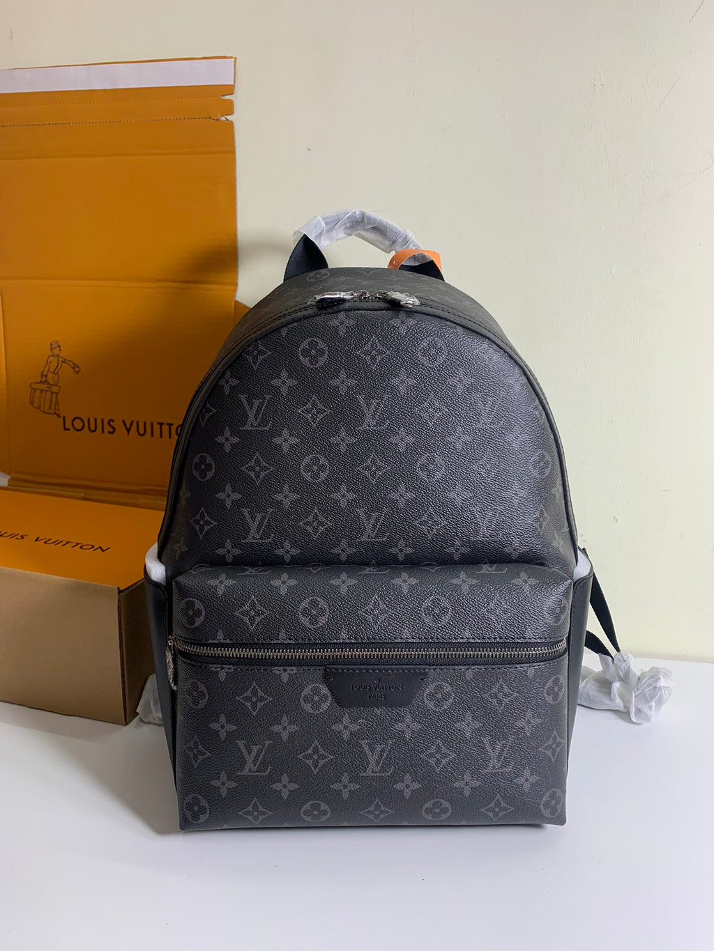 Monogram backpack with front zip pocket and adjustable shoulder straps