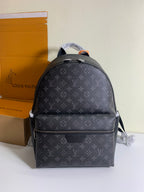 Monogram backpack with front zip pocket and adjustable shoulder straps