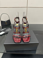 Red patent strappy high-heel sandals with gold YSL buckle and stiletto heels
