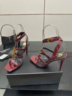 Red strappy heeled sandals with gold YSL buckle, clear and burgundy straps