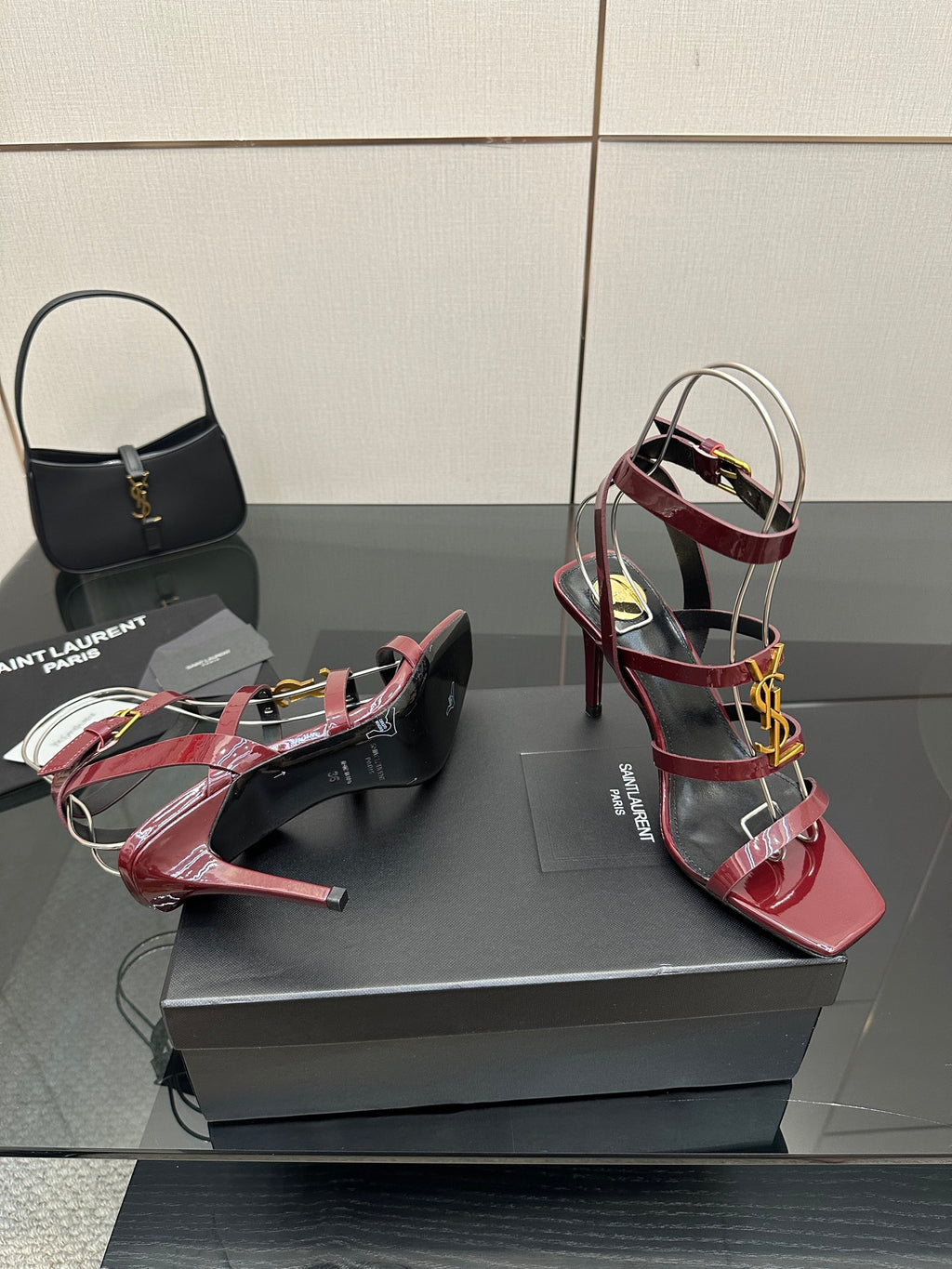 Red patent open-toe strappy sandals with gold YSL buckle and stiletto heels