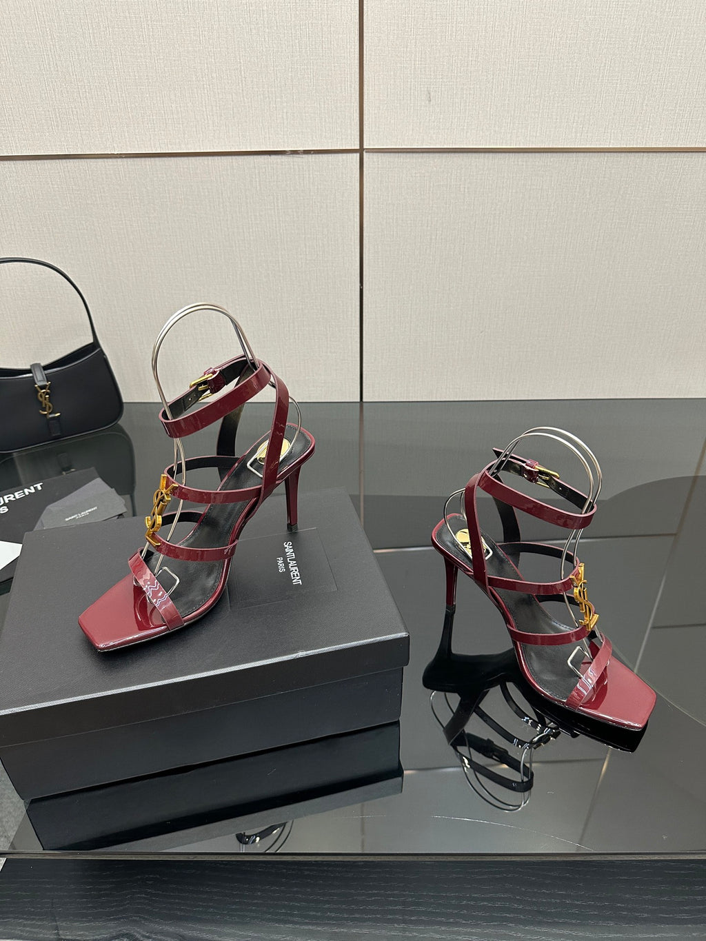 Red patent open-toe strappy sandals with gold YSL buckle and stiletto heel