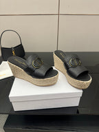 Black open-toe wedge sandals with gold buckle, espadrille platform, front view