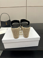Black wedge sandals with gold buckle and espadrille heels, back view pair