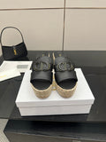 Black leather wedge sandals with gold buckle and espadrille platform, pair front view